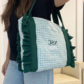 Bolso shopper acolchado pespuntes vichy celeste con volante en las asas verde botella