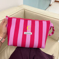 Neceser Essential rayas fucsia y rosa